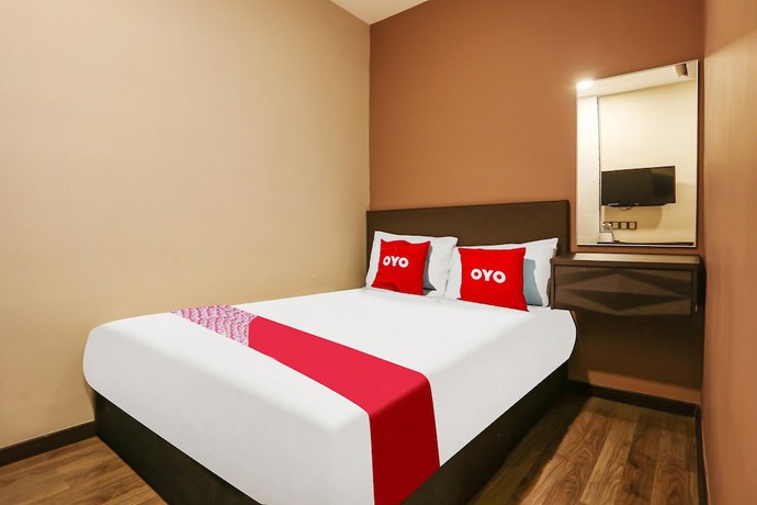 Imagen de la habitación del Hotel OYO 90474 Skycity Motel. Foto 10