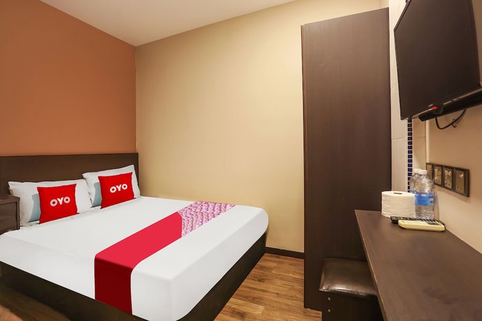 Imagen de la habitación del Hotel OYO 90474 Skycity Motel. Foto 11