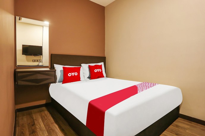 Imagen de la habitación del Hotel OYO 90474 Skycity Motel. Foto 13