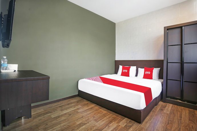 Imagen de la habitación del Hotel OYO 90474 Skycity Motel. Foto 17