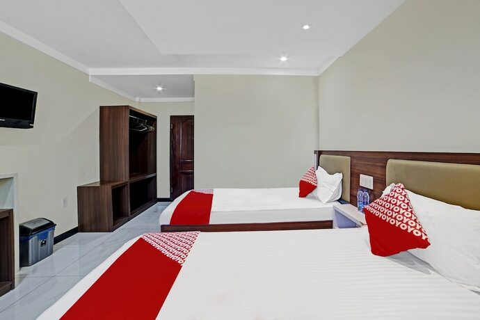 Imagen de la habitación del Hotel OYO 90487 Wisma Kuta Karang Baru. Foto 12