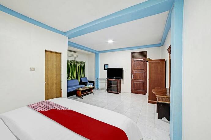 Imagen de la habitación del Hotel OYO 90487 Wisma Kuta Karang Baru. Foto 13