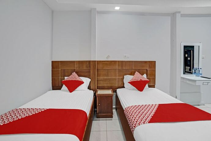 Imagen de la habitación del Hotel OYO 90487 Wisma Kuta Karang Baru. Foto 14