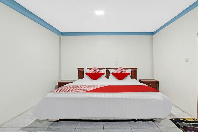 Imagen de la habitación del Hotel OYO 90487 Wisma Kuta Karang Baru. Foto 17