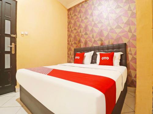 Imagen de la habitación del Hotel OYO 90492 Papi Inn Guesthouse. Foto 19