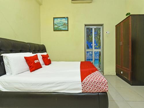 Imagen de la habitación del Hotel OYO 90508 Ummul Motel. Foto 6
