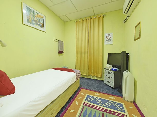 Imagen de la habitación del Hotel OYO 90535 Wakaf Bharu Inn. Foto 14