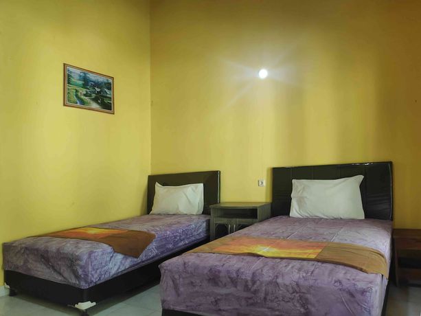 Imagen de la habitación del Hotel OYO 90547 Pondok Saren Anyar. Foto 6