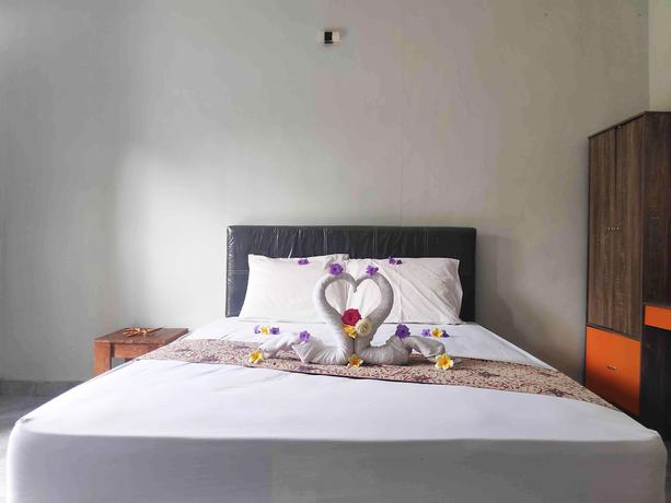 Imagen de la habitación del Hotel OYO 90547 Pondok Saren Anyar. Foto 9