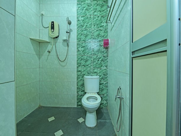Imagen de la habitación del Hotel OYO 90559 Ummul Motel C Mart. Foto 14