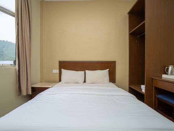 Imagen de la habitación del Hotel OYO 90568 Sutera Inanam. Foto 4