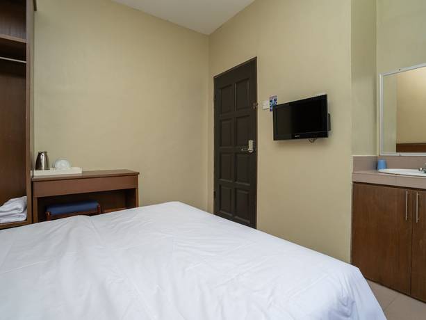 Imagen de la habitación del Hotel OYO 90568 Sutera Inanam. Foto 5