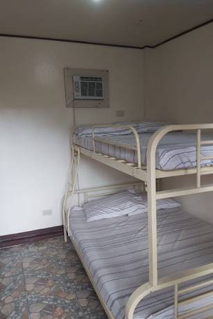 Imagen de la habitación del Hotel OYO 906 Cas Elixir Resort. Foto 4