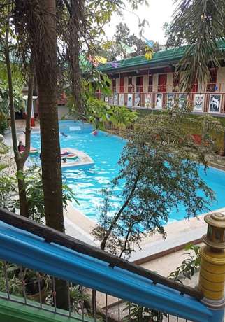 Imagen de la piscina del Hotel OYO 906 Cas Elixir Resort. Foto 16