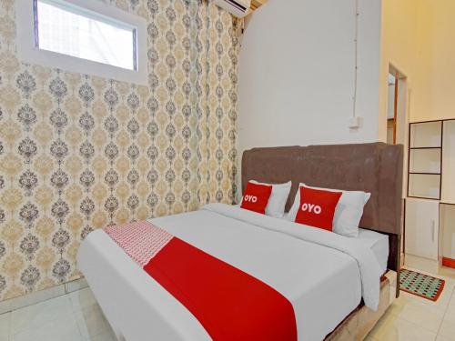 Imagen de la habitación del Hotel OYO 90615 Jojo Homestay. Foto 17
