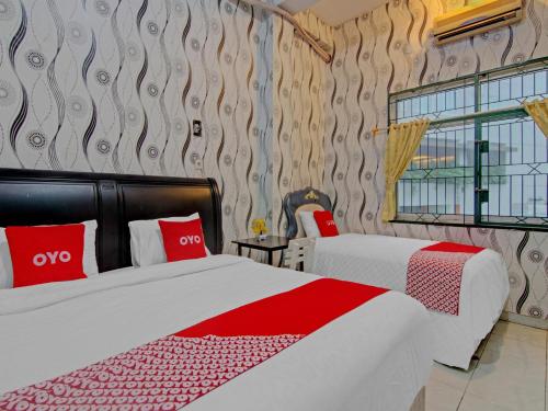Imagen de la habitación del Hotel OYO 90615 Jojo Homestay. Foto 19