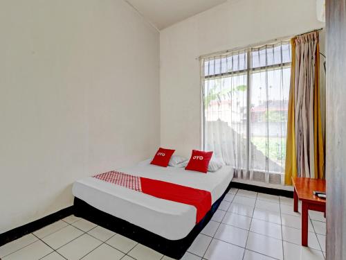 Imagen de la habitación del Hotel OYO 90621 Pondok 23, Jatinangor. Foto 19