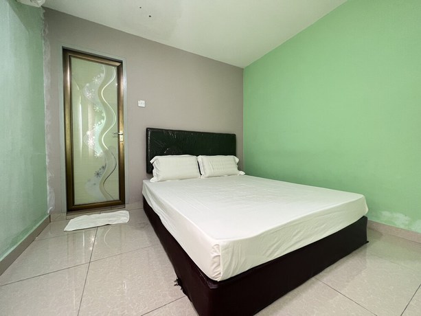 Imagen de la habitación del Hotel OYO 90621 Stutong Stay. Foto 3