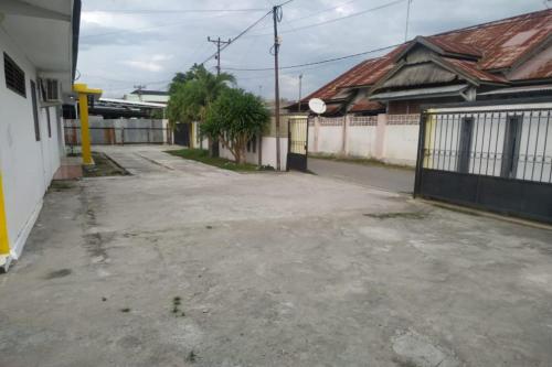 Imagen general del Hotel OYO 90699 Yellow White Guesthouse Palu. Foto 1