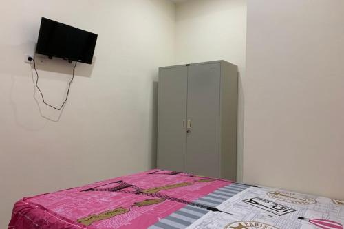 Imagen general del Hotel OYO 90699 Yellow White Guesthouse Palu. Foto 14