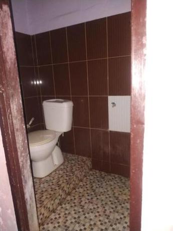 Imagen de la habitación del Hotel OYO 90699 Yellow White Guesthouse Palu. Foto 19