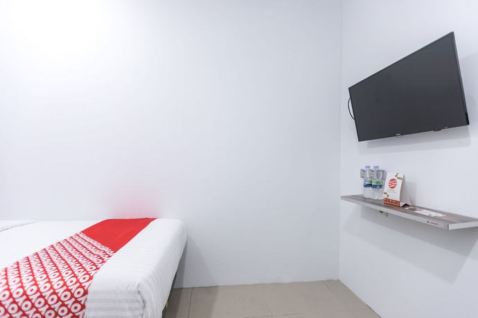 Imagen de la habitación del Hotel OYO 907 Wisma Cakung. Foto 11