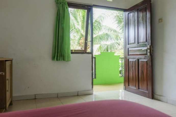 Imagen de la habitación del Hotel OYO 90714 Umah Pande Tabanan Near Tanah Lot. Foto 5