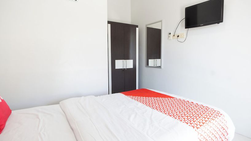 Imagen de la habitación del Hotel OYO 90730 Padekosan. Foto 10