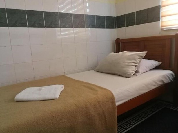 Imagen de la habitación del Hotel OYO 90762 Fs Dimensi. Foto 7