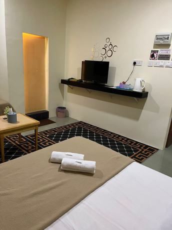 Imagen de la habitación del Hotel OYO 90762 Fs Dimensi. Foto 9