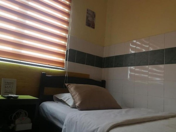 Imagen de la habitación del Hotel OYO 90762 Fs Dimensi. Foto 10