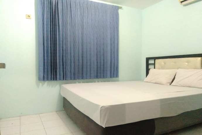 Imagen de la habitación del Hotel OYO 90766 Gardenia Boarding House. Foto 3