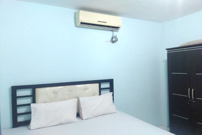 Imagen de la habitación del Hotel OYO 90766 Gardenia Boarding House. Foto 8