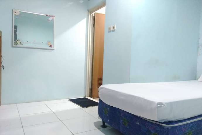 Imagen de la habitación del Hotel OYO 90766 Gardenia Boarding House. Foto 11