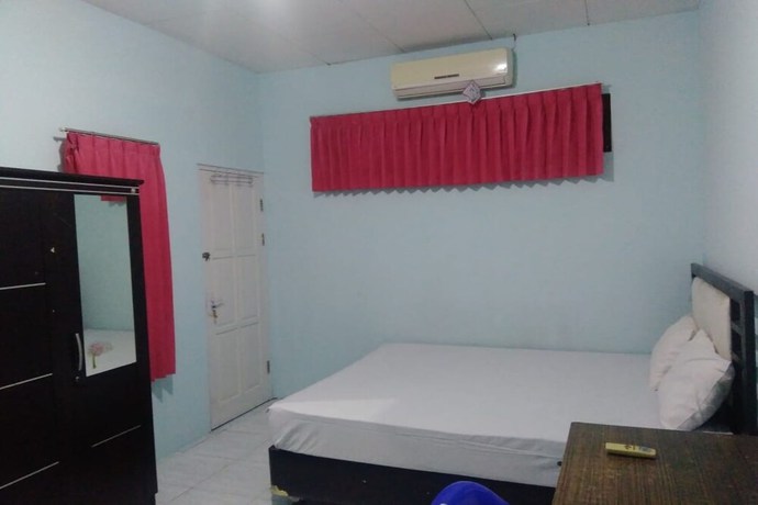 Imagen de la habitación del Hotel OYO 90766 Gardenia Boarding House. Foto 12
