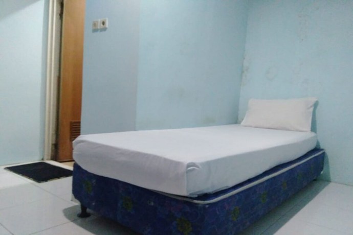 Imagen de la habitación del Hotel OYO 90766 Gardenia Boarding House. Foto 13