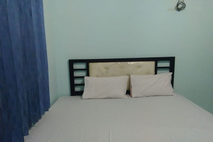 Imagen de la habitación del Hotel OYO 90766 Gardenia Boarding House. Foto 15