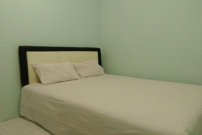 Imagen de la habitación del Hotel OYO 90766 Gardenia Boarding House. Foto 16