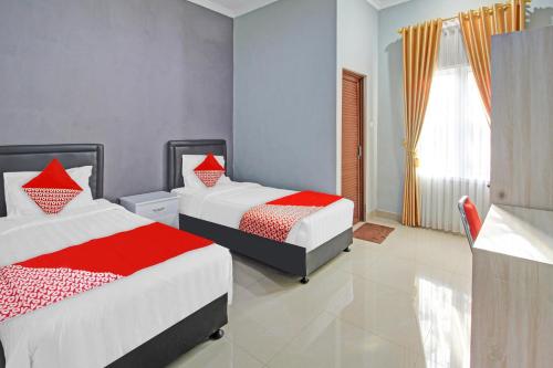 Imagen de la habitación del Hotel OYO 90767 Gm Guest House. Foto 20