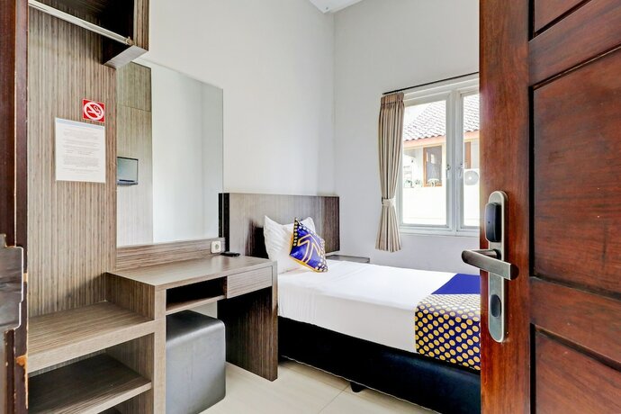 Imagen de la habitación del Hotel OYO 90777 D'river Guest House. Foto 17