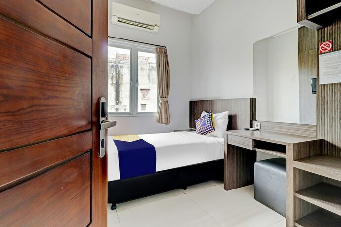 Imagen de la habitación del Hotel OYO 90777 D'river Guest House. Foto 18
