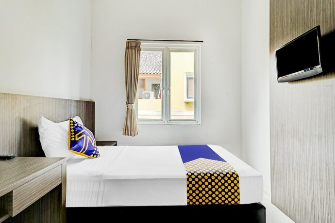 Imagen de la habitación del Hotel OYO 90777 D'river Guest House. Foto 19