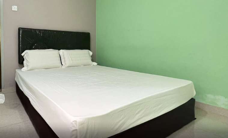Imagen de la habitación del Hotel OYO 90789 Stutong Point. Foto 5