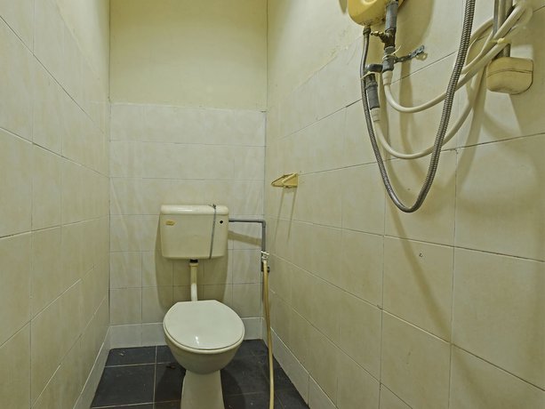 Imagen de la habitación del Hotel OYO 90794 Maple. Foto 10