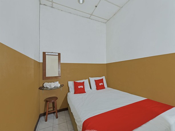 Imagen de la habitación del Hotel OYO 90794 Maple. Foto 11