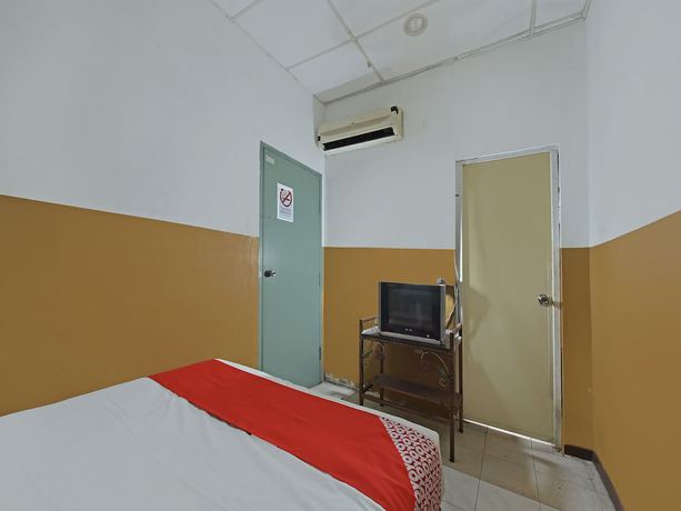 Imagen de la habitación del Hotel OYO 90794 Maple. Foto 12