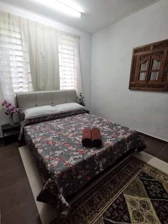 Imagen de la habitación del Hotel OYO 90797 Napoh Motel. Foto 5