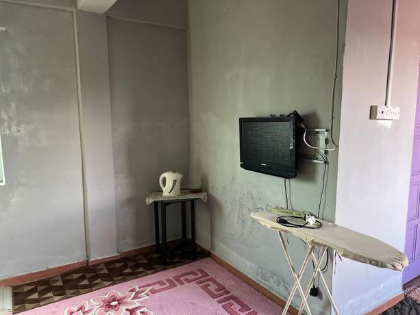 Imagen de la habitación del Hotel OYO 90797 Napoh Motel. Foto 9