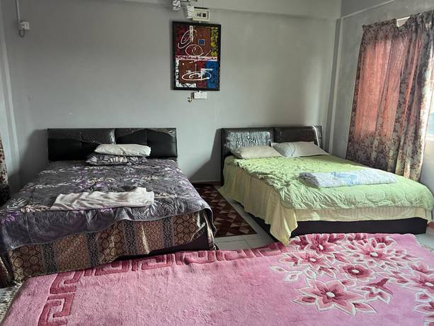 Imagen de la habitación del Hotel OYO 90797 Napoh Motel. Foto 10