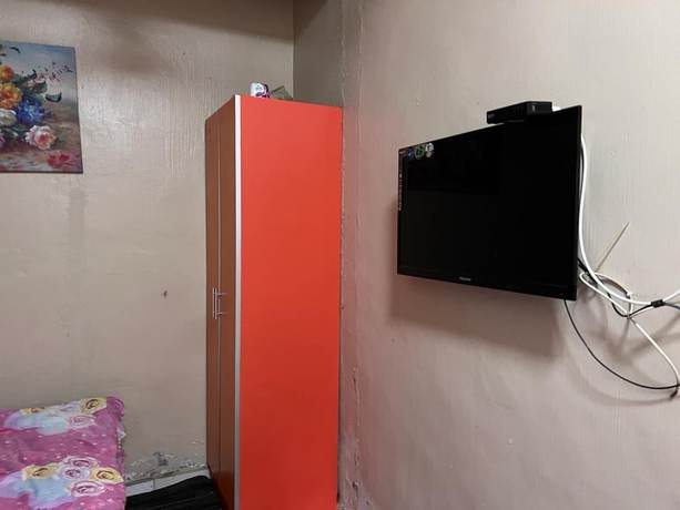 Imagen de la habitación del Hotel OYO 90797 Napoh Motel. Foto 11